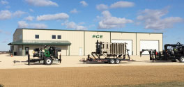 the Puck office and warehouse in Farley, Iowa with equipment parked in front