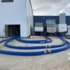 four Chiller hoses connecting 3 mobile Daikin units to the interior of a building