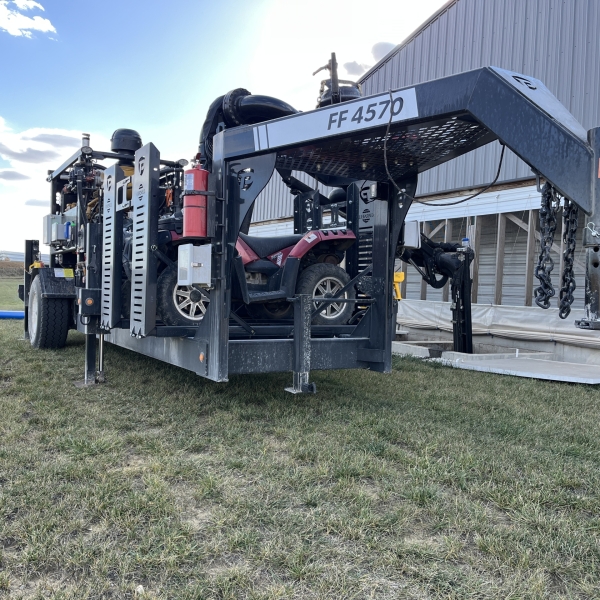 the front angled side of a FF 4570 with boom extended into a pit