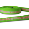 Hi vis Hi-Combat hose rolled in a donut on its side showing off etching