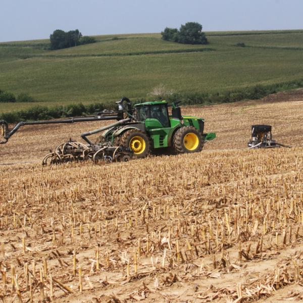 Puck swingarm, toolbar, and pump in a field