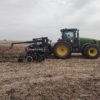 a 3PT toolbar mounted on a tractor with drag hose on the swingarm