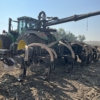 a 4WD toolbar mounted on a tractor with drag hose on the swingarm