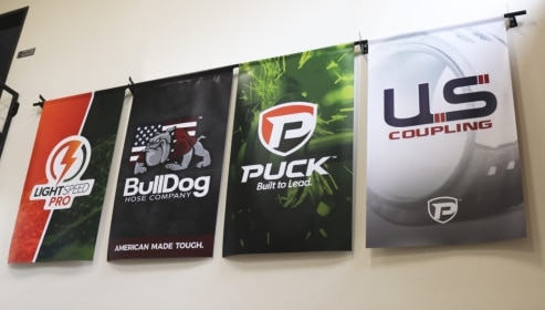 all 4 Puck company brand banners hanging on the wall