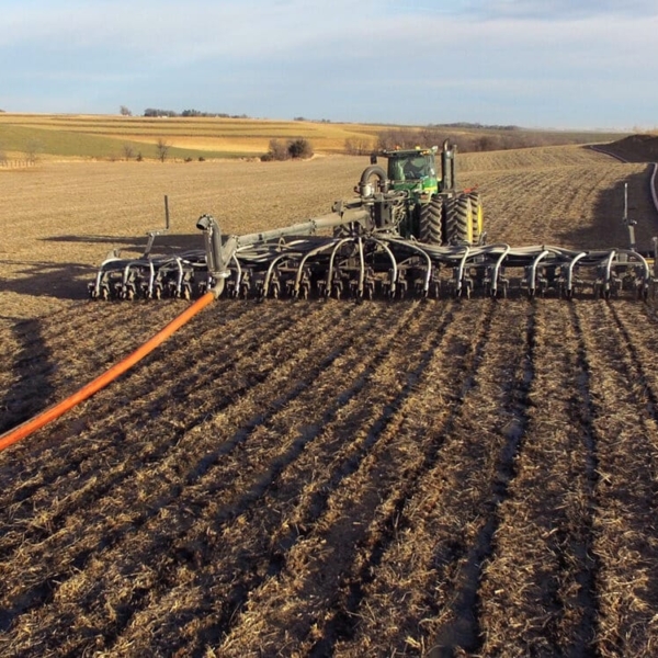 Puck pull type toolbar working in the field with attached drag line hose