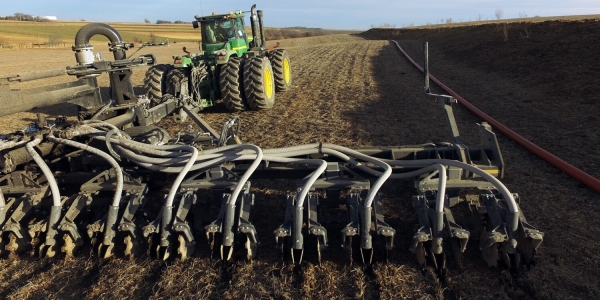 close view of Puck pull-type toolbar behind a tractor in the field