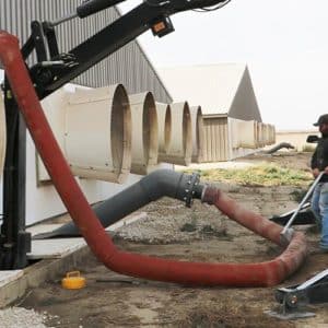 a mass agitation system in use with attached hoses as a man watches