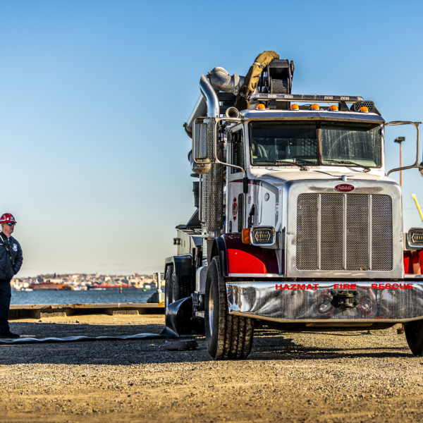 standing next to a force feed truck