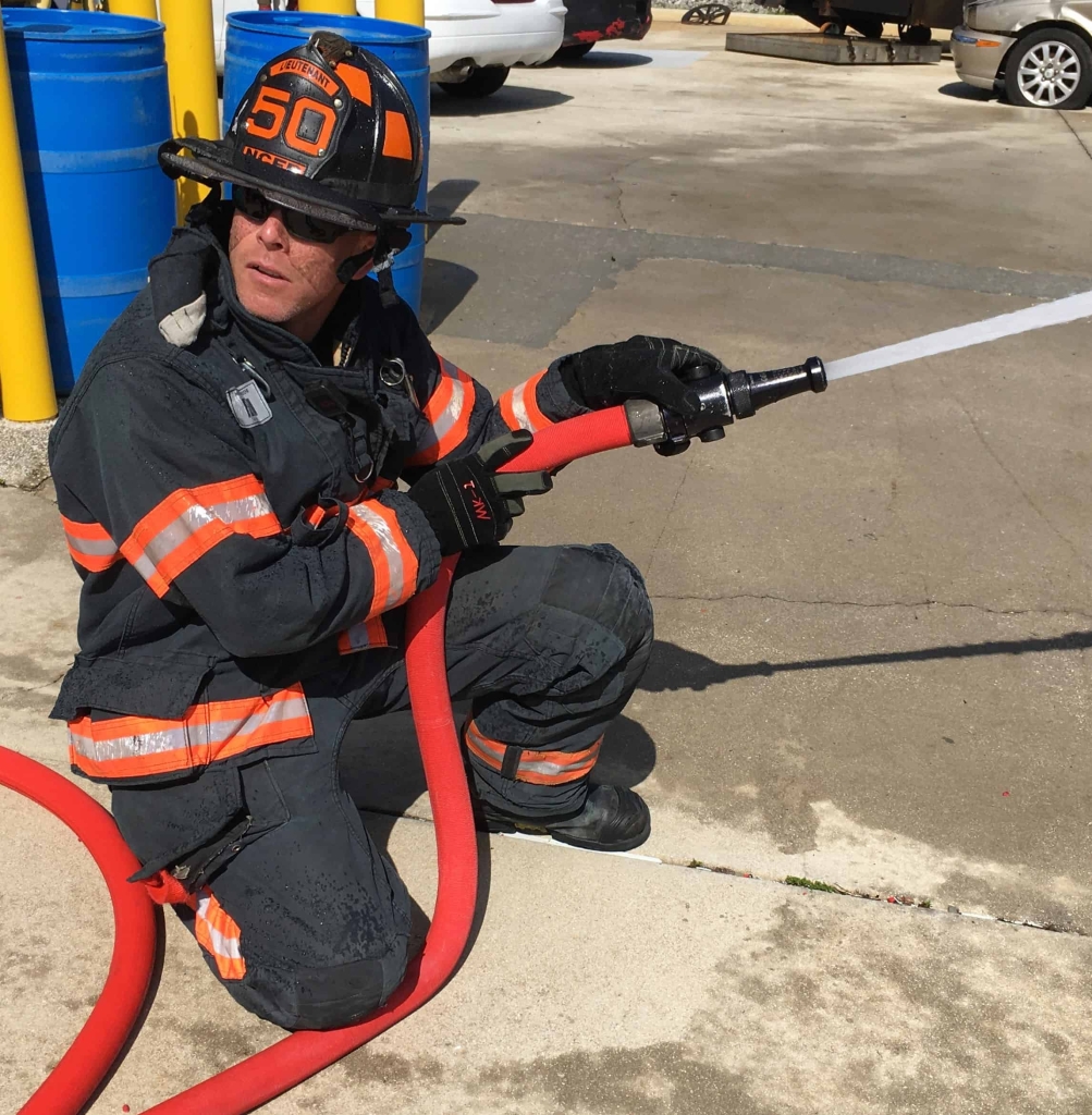 a firefighter testing the Ultima hose