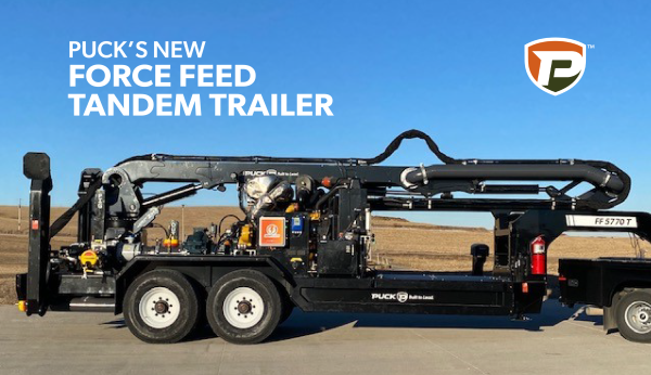 a passenger side view of the Puck Force Feed with the overlaid title Puck's New Force Feed Tandem Trailer