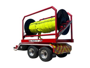 rear driver side view of Puck Fire TTR15P in transport mode with hi-vis TPU supply hose Hi-Vol TPU on the reel