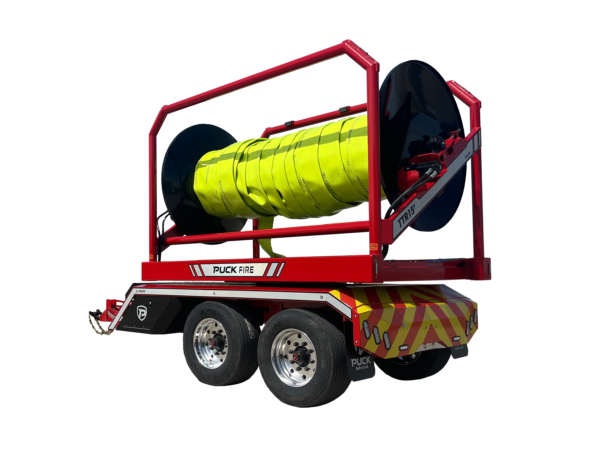 rear driver side view of Puck Fire TTR15P in transport mode with hi-vis TPU supply hose Hi-Vol TPU on the reel