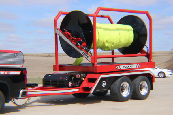 front drivers side angle of Puck Fire TTR15P in transport mode with hi-vis TPU supply hose Hi-Vol TPU on the reel