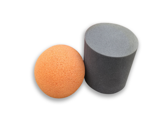orange foam pigging ball and gray bullet