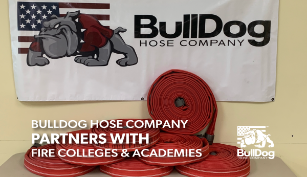 a table covered in donut rolls of red fire hose under a banner with the BullDog Hose Company logo and the overlaid title BullDog Hose Company Partners with Fire Colleges & Academies