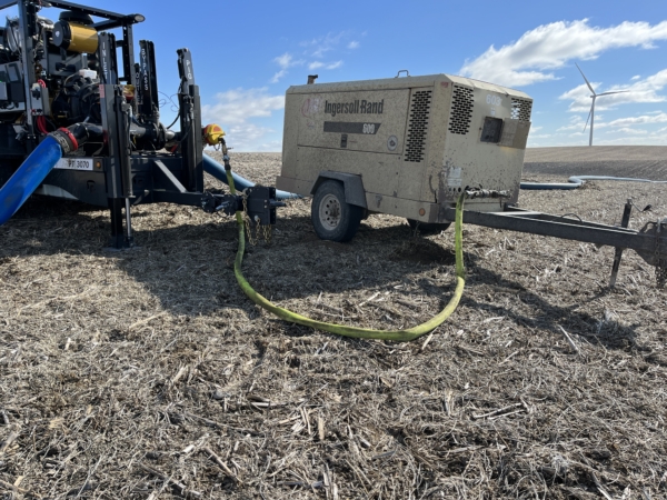 PT 3070 and air compressor in field connected with Air Raid lay flat air hose