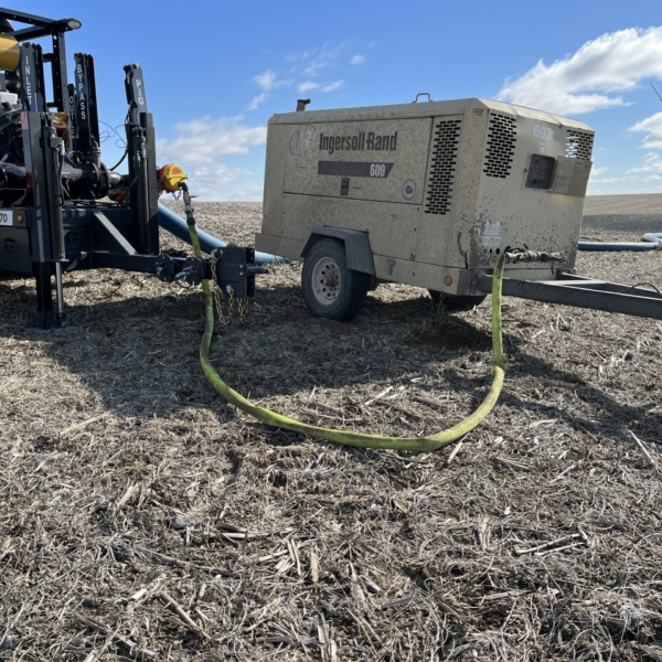 PT 3070 and air compressor in field connected with Air Raid lay flat air hose