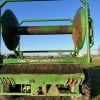 the back of a green 2017 Puck TTR20 turn table reel hose cart parked in a field