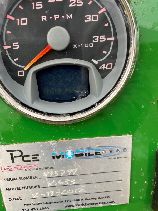 the model and serial numbers and gauge of a 2012 Puck manure boat, displaying 2140 total hours