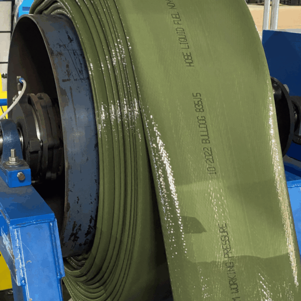 a close view of the green HD Fuel Hose unrolling