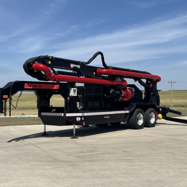 the FF4500-45 with a folded boom and extended outriggers sitting outside