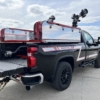 a black truck with Puck Fire Quick Attack apparatus attached to the bed
