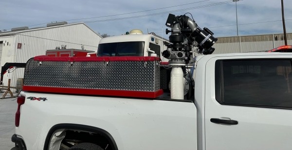 a passenger side view of the bed of the Quick Attack truck displaying a hose tray and hose hookups