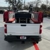 a back side view of the Quick Attack truck bed. the door is closed and the hose trays and attachments are above it on each side