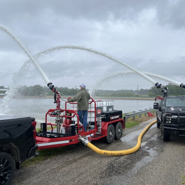 Foam tote trailer and Quick Attack spraying water into pond