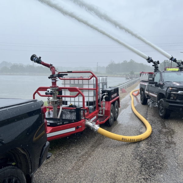 Foam tote trailer and Quick Attack spraying water into pond