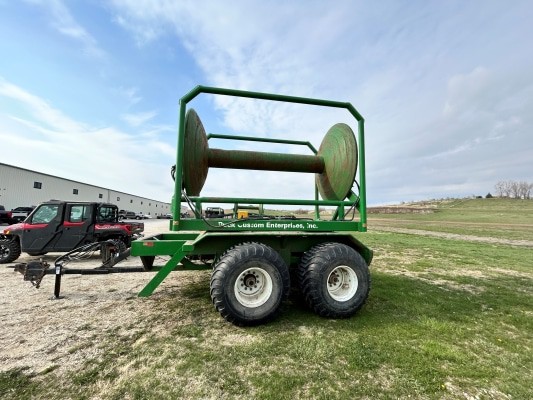 side view a used green PCE turn table reel