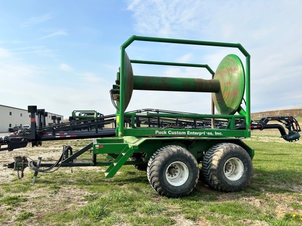 side view a used green PCE turn table reel