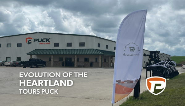 a flag banner for Evolution of the Heartland outside of the Puck Manning offices