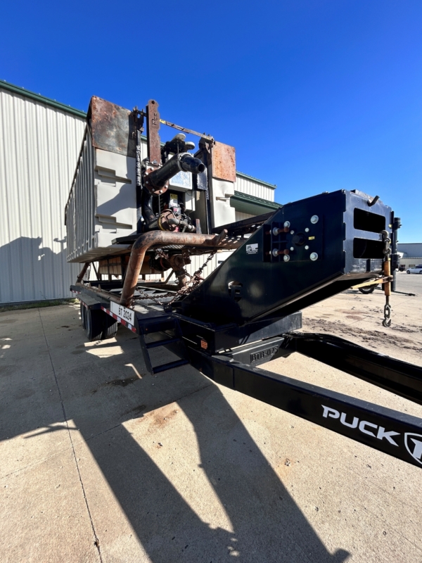 the front passenger side of a used agitation boat on an agitation trailer