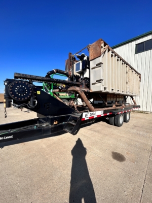 the front of a used agitation boat on a boat trailer