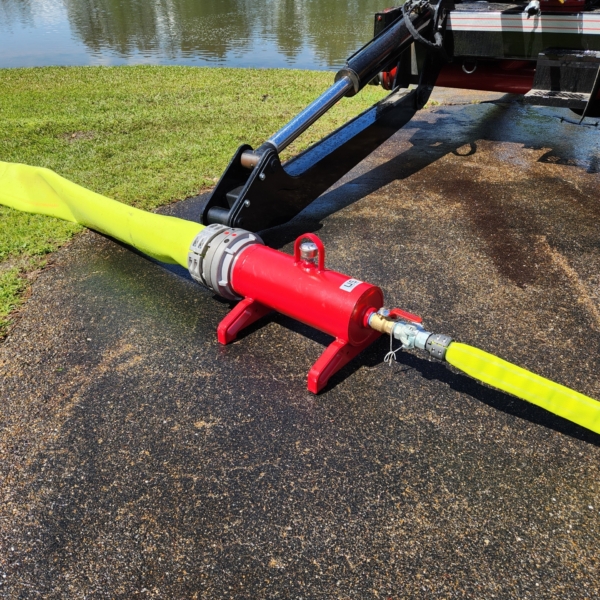 an Air Raid hose connected to one side of a Puck Fire manifold, which has a large diameter Hi-Vol TPU hose connected to the other end