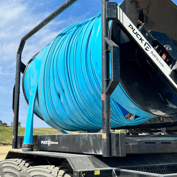BullDog's X24 light blue drag hose rolled on a Puck TTR 20 hose cart