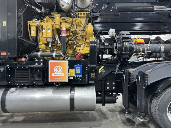 close up view of drivers side of Puck Boom Truck with Cat engine, Cornell pump, and LightSpeed control system