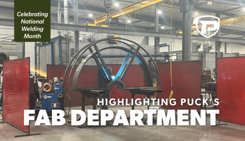 a Puck fabrication technician welding half of a hose mover with the overlaid title Highlighting Puck's Fabrication Department with a banner that reads Celebrating National Welding Month