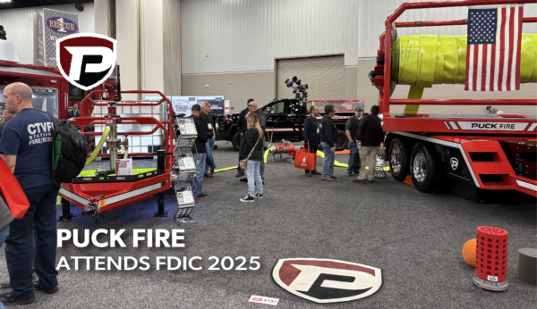 an image ofth ePuck Fire booth with TTR15P, Foam Tote Trailer and Quick Attack at FDIC 2025