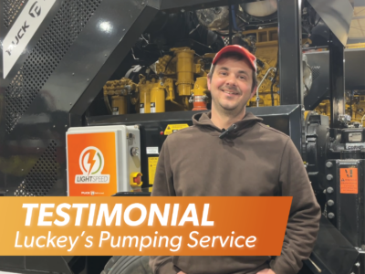 Kyle Luckey in front of a Puck pump trailer with the overlaid title reading Testimonial Luckey's Pumping Service