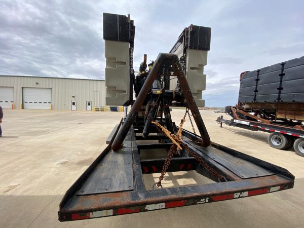 the back of a Puck Used Equipment - B221-Agitation Boat with trailer
