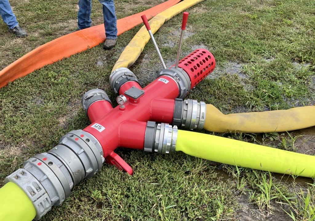 a US Coupling manifold with 4 supply hoses attached and a pig catcher on the end