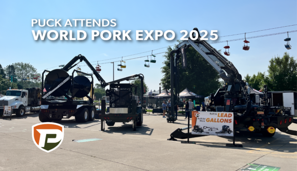 booth SV500 outside the varied industries building of Iowa State Fairgrounds with a Puck Boom Truck, 20, PT 3070, and FF 5770 T equipment parked in front of the giant slide and sky lift