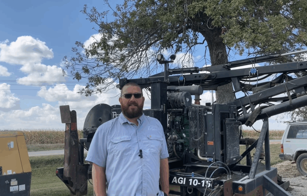 Josh Gieselhart with one of the first Puck agitation trailers still in use at Reicks View Farms