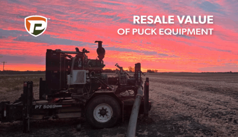 an older version of a Puck pump trailer in the field at sunset with the overlaid title reading Resale Value of Puck Equipment